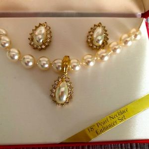 Costume jewelry- 18” Pearl necklace and earrings with rhinestones.
